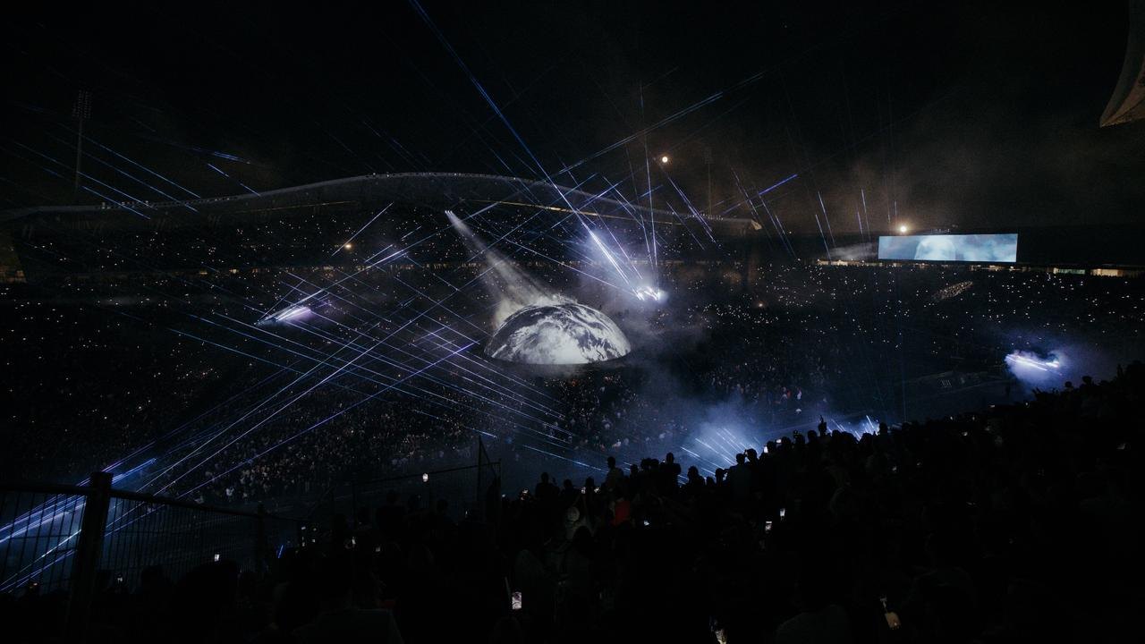 Lasers over the globe stage and the full stadium